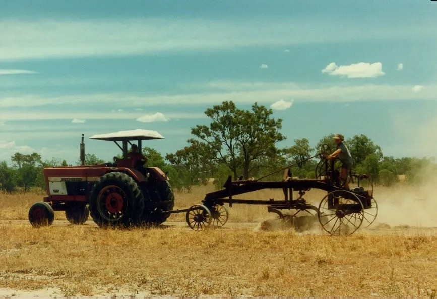 An early tractor working in open country